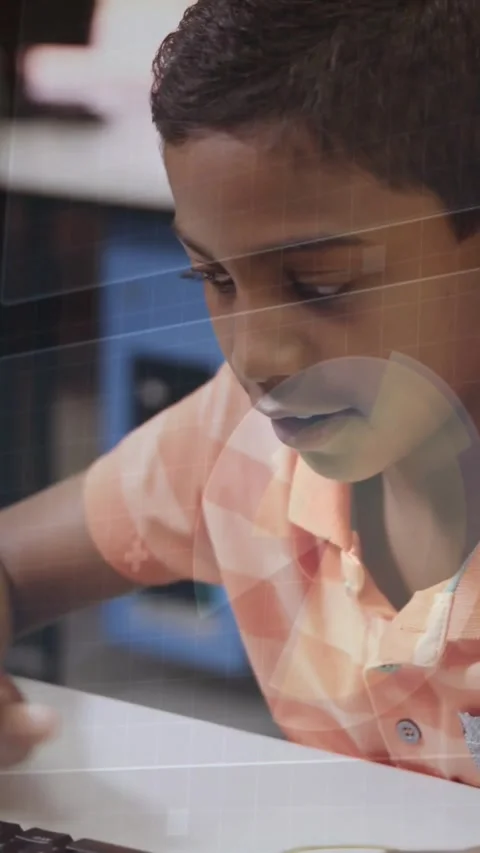 Vertical video: Typing peach-polo pupil in lab starting classwork on keys, Stock Footage 331166971