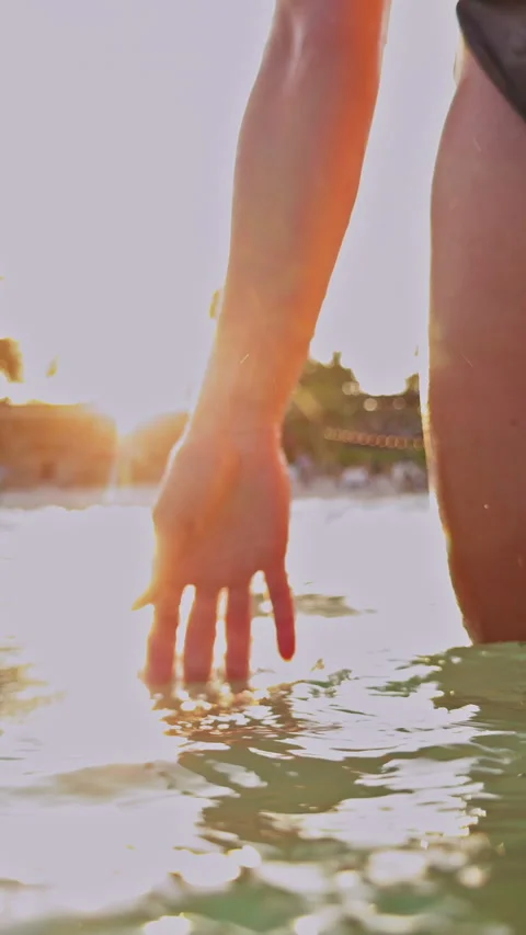 Vertical video. Underwater To Surface Transition With Sunlight And Bubbles Aroun Stock Footage 333308075