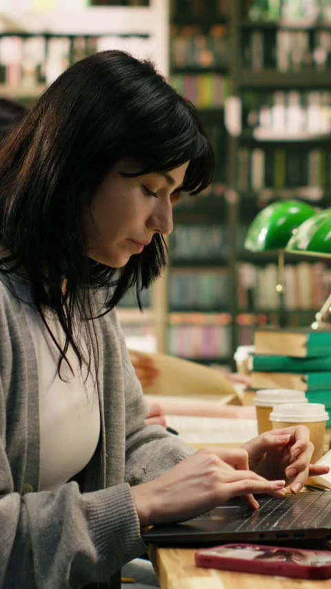 Vertical Video University student getting distracted by notification on phone Stock Footage 336380363