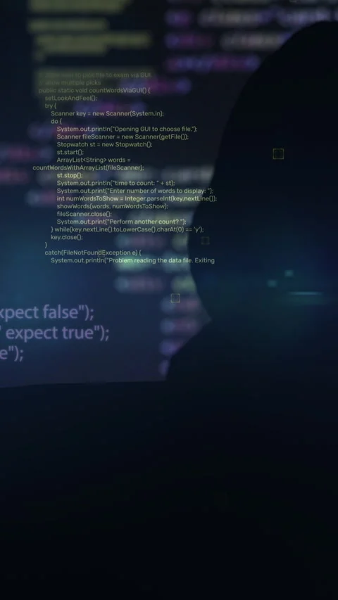 Vertical video. Unrecognizable man hacker wearing sweatshirt with hood typing on Видео 347148484