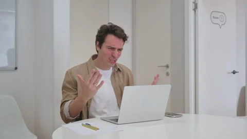 Vertical Video, Unsatisfied Young Creative Man Working on Laptop Stock-Footage 312914044