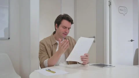 Vertical Video, Upset Young Creative Man Cursing Business Report Problems Stock Footage 312914122