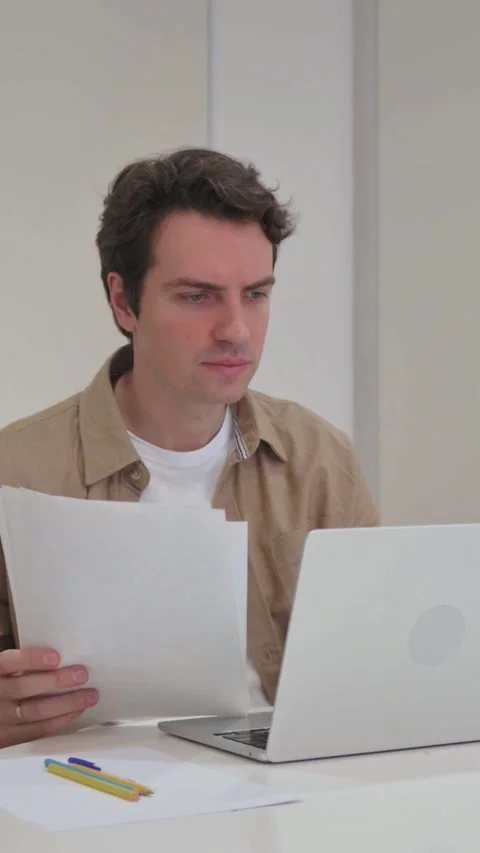 Vertical Video, Upset Young Creative Man Cursing while Working on Laptop and Stock Footage 318045256