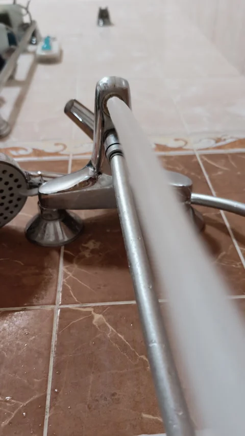 Vertical video upward view of water stream flowing from faucet in bathroom Stock Footage 313136256