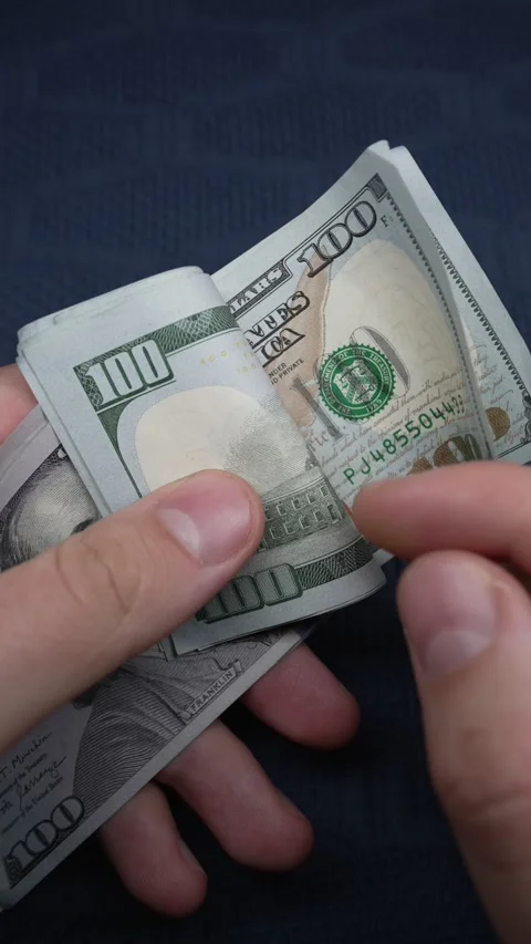 Vertical video of US currency - dollars ... | Stock Video | Pond5