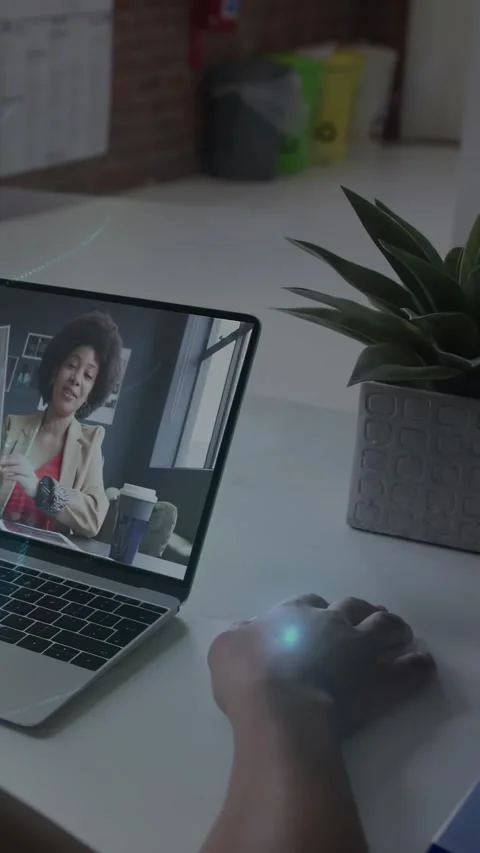 Vertical video: User clicking mouse, starting blue UI while host gesturing Stock Footage 334317910