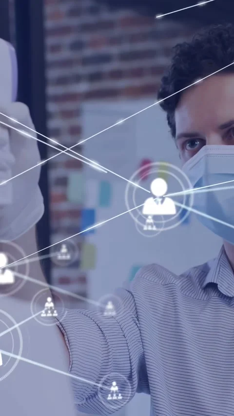 Vertical video: User icon appearing, masked man gesturing with device as net Stock Footage 334396173