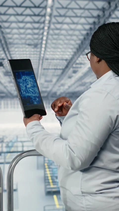 Vertical video Using AI deep learning, EDA software and woman monitoring PCB Stock Footage 333614475