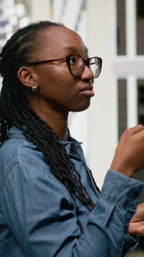 Vertical Video Using navigation app on smartphone, black woman walking around Stock Footage 334201897
