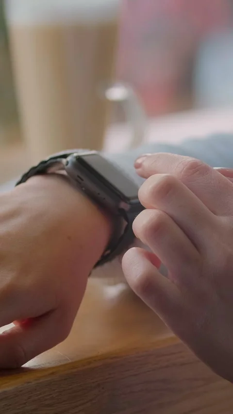 Vertical video. Using smartwatch touchscreen device. Closeup. Stock Footage 340980762