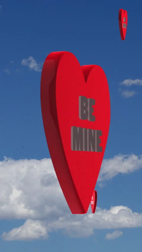 Vertical Video Valentines Day Be Mine Flying Candy Hearts and Fluffy Clouds Stock Footage 230028442