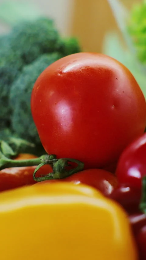 Vertical video. Vegetables on table. Organic foods. Healthy vegan lifestyle. Stock Footage 345059379