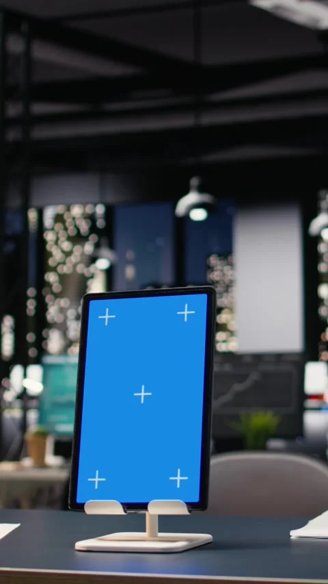 Vertical Video Vertical blue screen tablet in empty corporate office with Stock Footage 334103542