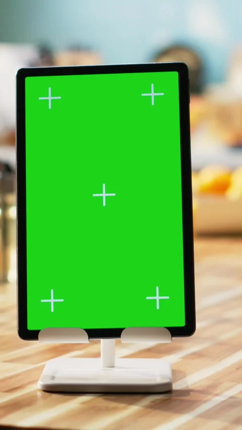 Vertical Video Vertical chroma key on tablet screen in empty kitchen table Stock Footage 323403627