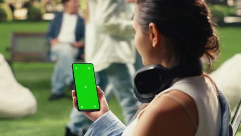 Vertical Video Vertical green screen phone mockup held by student on university Stock Footage 340801471