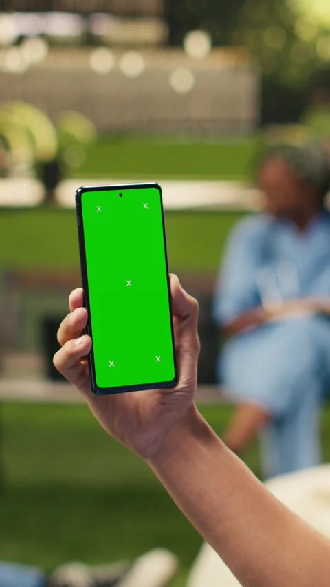 Vertical Video Vertical green screen smartphone mockup fills lower frame in Stock Footage 341321133
