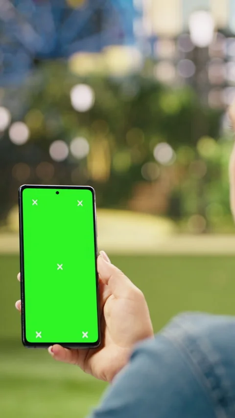 Vertical Video Vertical green screen isolated mockup on smartphone held by woman Stock Footage 344380322