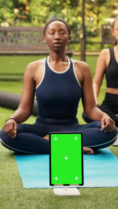 Vertical Video Vertical green screen mockup on tablet near participants doing Stock Footage 346615363