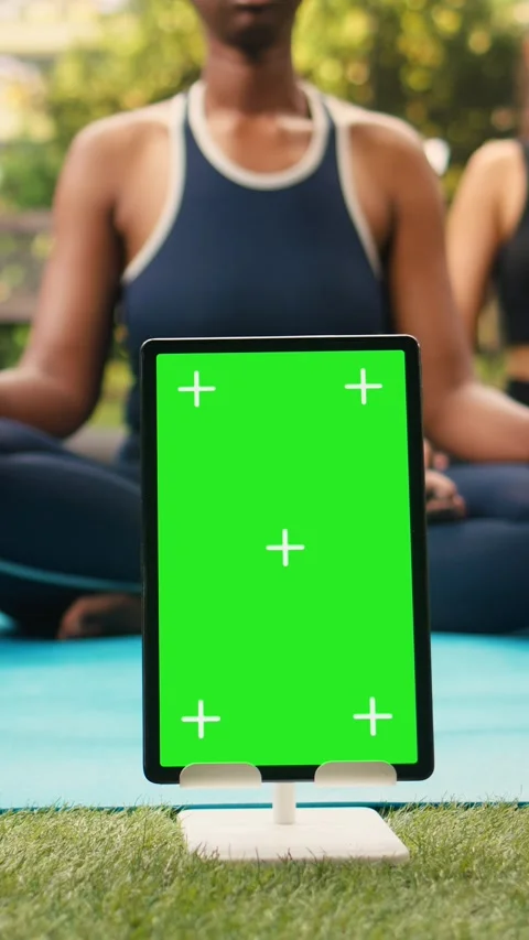Vertical Video Vertical green screen mockup on tablet near participants doing Stock Footage 346616387