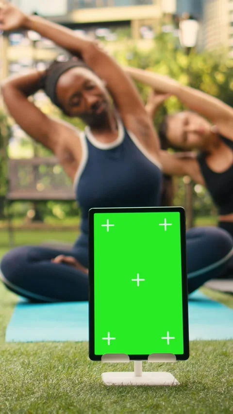 Vertical Video Vertical green screen mockup on tablet with editable display Stock Footage 346616431
