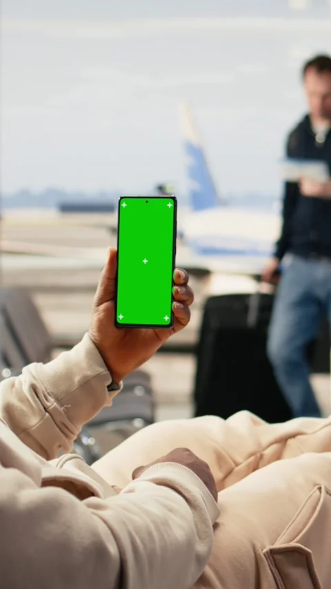 Vertical Video Vertical mockup phone with travel entrepreneur in airport waiting Stock Footage 333612010