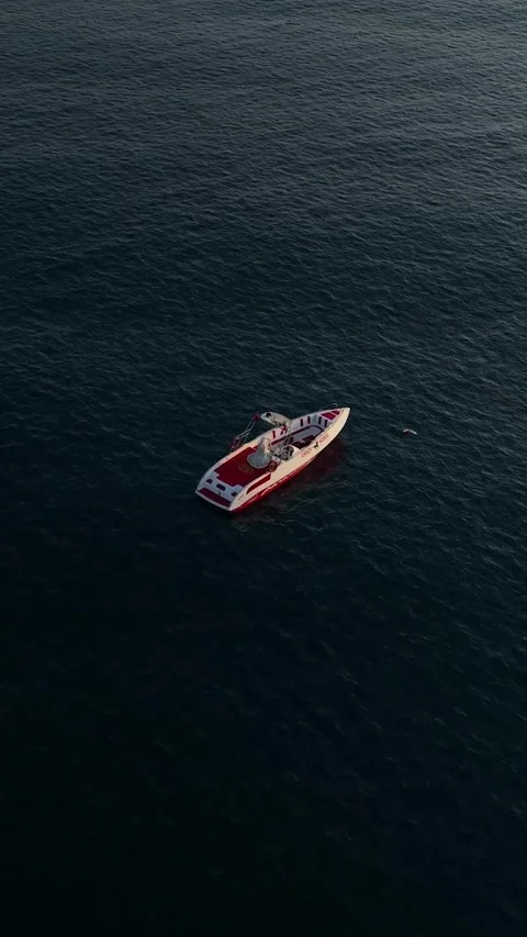 Vertical Video: Vibrant Mediterranean Beach with Parasailing Over the Water and Stock Footage 297719189
