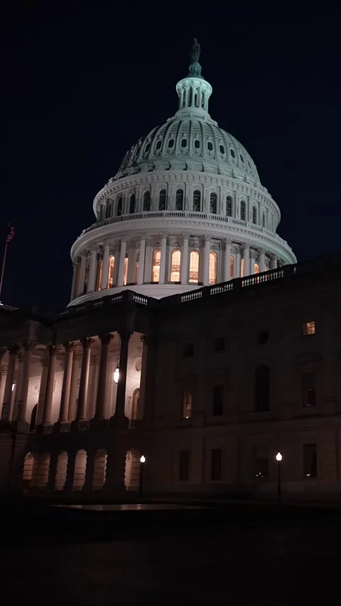 Vertical video view to left showing the East side of the US Capitol with lights Stock Footage 314658595