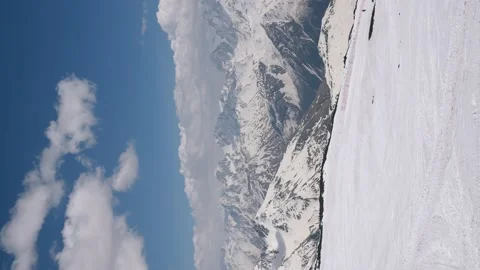 Vertical video. View from Mount Elbrus to snow-covered ridge Caucasus Mountains Stock-Footage 169034625