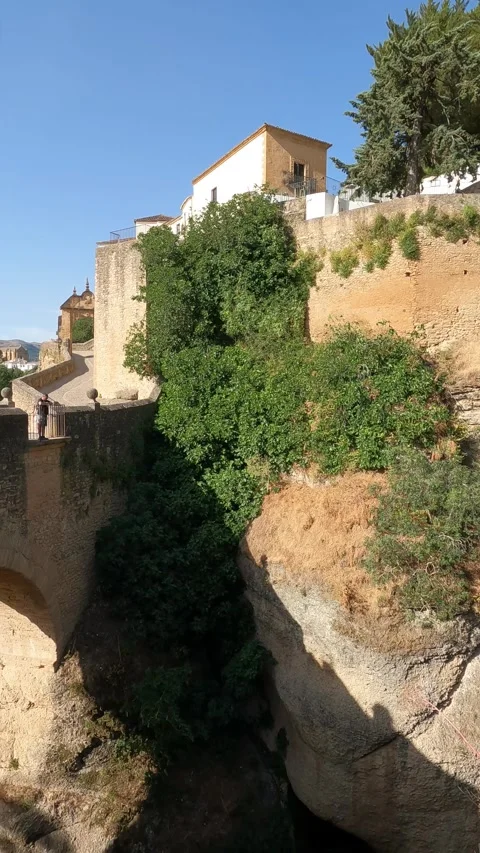 Vertical video view of the old stone bridge over the Guadalevín, Ronda Stock Footage 344577802