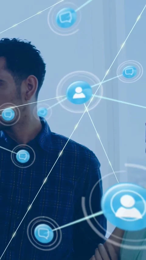 Vertical video: View widening, man at glass initiating blue node map, tech team Stock Footage 334602886