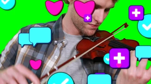Vertical video: Violinist starting playing music, bowing strings on screen while Stock Footage 331757645