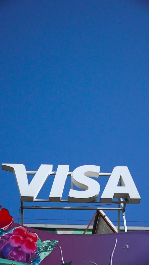 Vertical video of Visa company logo three dimensional white letters against sky. Stock Footage 330535073