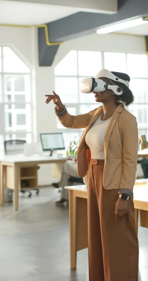 Vertical video: At VR interface start woman is pointing and gesturing to Stock Footage 345491675