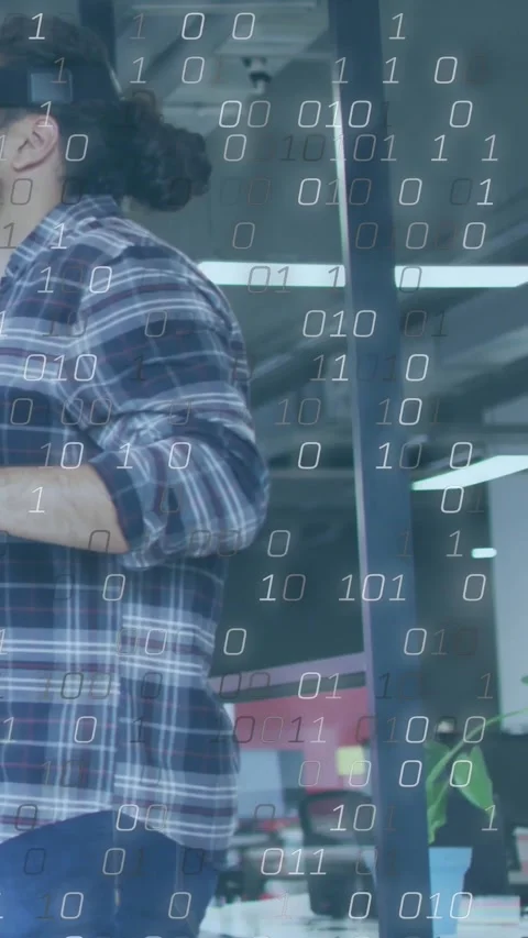 Vertical video: Walking man in plaid testing headset by glass partition, binary Stock Footage 334319301