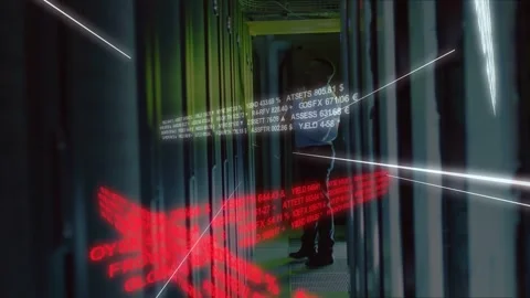 Vertical video: Walking tech in pale shirt boots checking rack in server aisle Stock Footage 331701526