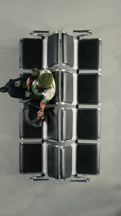 Vertical video Walking, trolleys and top down view of crowd with backpacks in Stock Footage 334850218