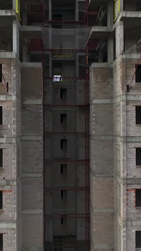 Vertical Video of Wall Reinforcement Work on Multi-Story Building Stock Footage 342407291