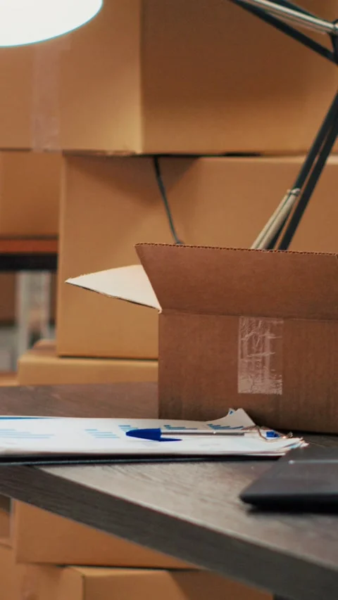 Vertical video: Warehouse filled with racks and shelves to put cardboard boxes Stock Footage 229000375