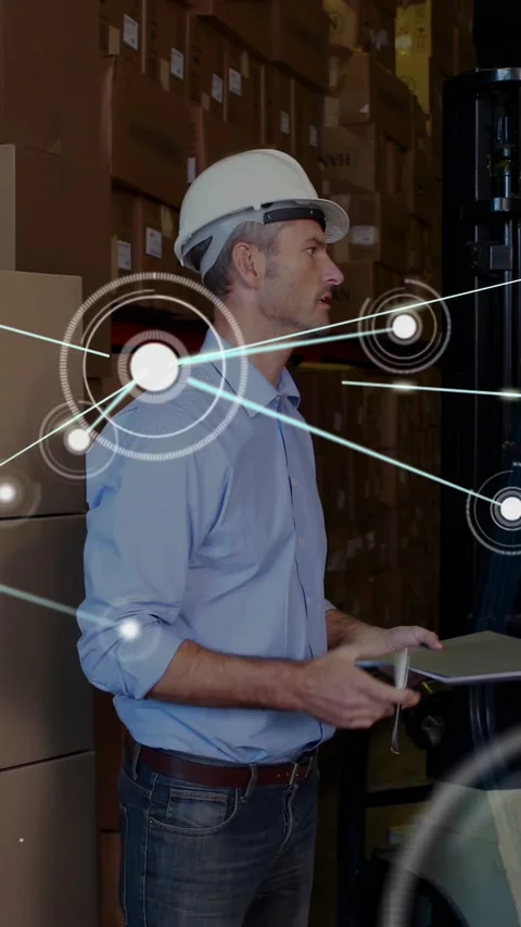 Vertical video: Warehouse lead checking forklift boxes on driver cue noting via Stock Footage 330195914