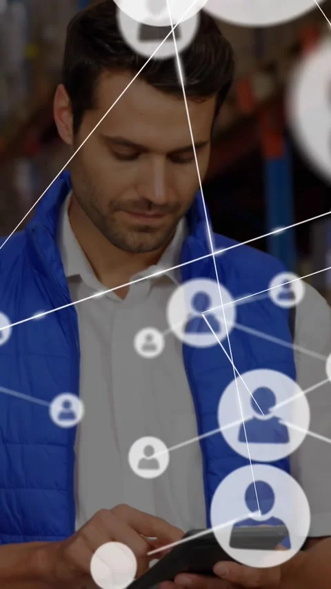 Vertical video: Warehouse man tapping phone, sparking node lines over face while 스톡 동영상 329934524