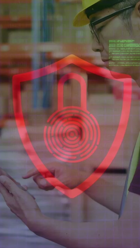 Vertical video: Warehouse tech tapping tablet causing padlock shield flashing Stock Footage 334530089