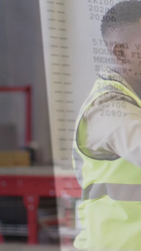 Vertical video: Warehouse tech turning as data overlay scrolling in, checking Stock Footage 330429990