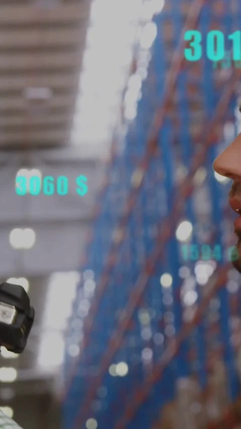 Vertical video: Warehouse worker scanning shelf as turquoise numbers appearing, Stock Footage 334396238