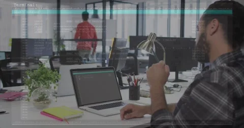 Vertical video: Watching coder in office checking laptop for output as overlay Stock Footage 331404330