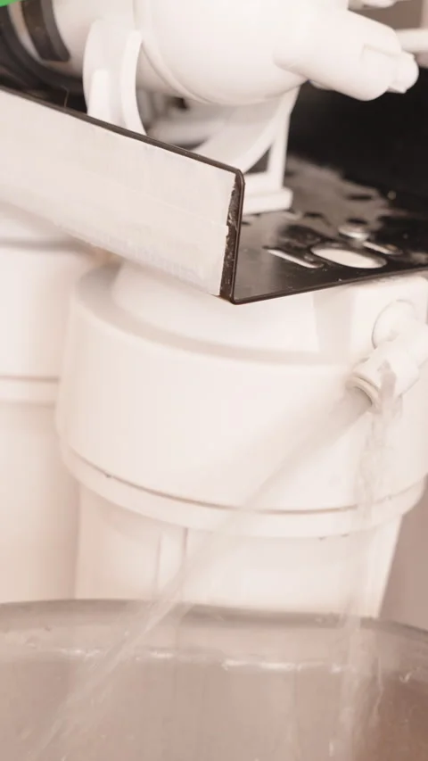 Vertical video. Water Flowing from the Reverse Osmosis System During a Test Stock Footage 296573897