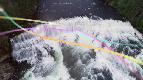 Vertical video: Waterfall, rapids cascading under drone pullback, color arcs Video stock 333277981