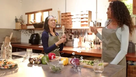 Vertical video: Waving utensil sparking women in aprons miming for fun with Stock Footage 334183234
