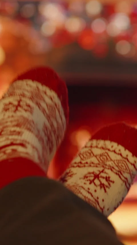 Vertical video. Wearing Red and White Patterned Socks Sitting with Feet Up by Fi Stock Footage 340264492