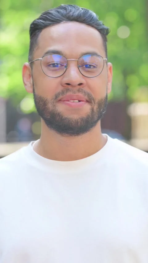 Vertical video, Webcam View of Talking Young Man Doing Video Chat Stock Footage 320239128