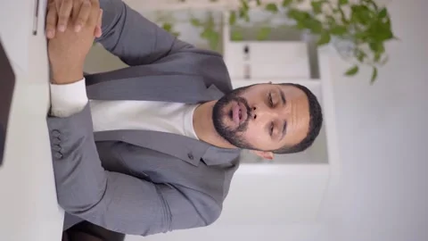 Vertical video. Webcam view of a video conference of a latin businessman looking Stock Footage 170215433